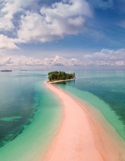 Island surrounded by blue sea