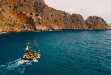 a ship sailing on the blue and clear ocean